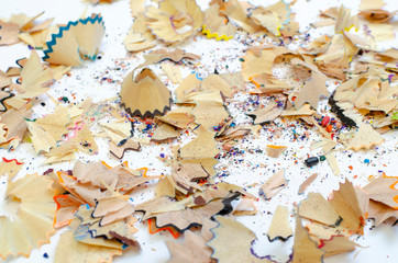 on white background shavings from colored pencils
