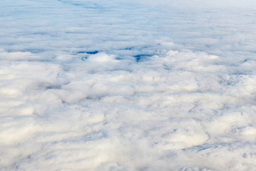 Top view on dense white clouds.