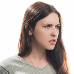 Naklejka premium young angry brunet woman portrait isolated on white background