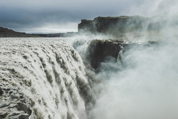 Dettifoss waterfall in Iceland. The most powerful waterfall in Europe. Breathtaking and dramatic view. Close-up view of flowing water stream.