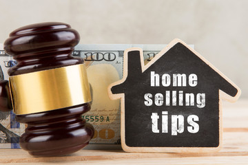 Real estate concept - Home selling tips, gavel and house model