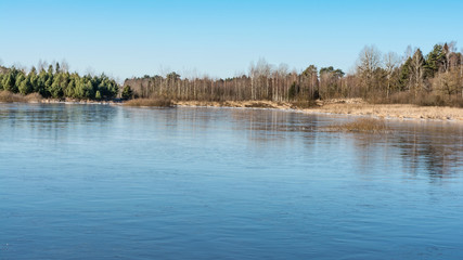 Autumn view of lake and trees reflections in wedge pond,