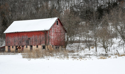 Weathered wood barn in winter