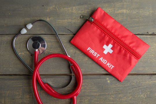 First aid medical kit on wood background,copy space,top view