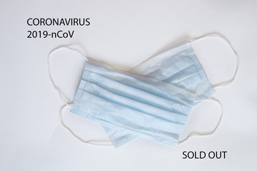 Respiratory mask, syringe and text Coronavirus and Sold out on white background. Novel coronavirus...