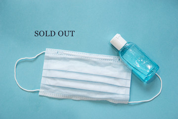 Text phrase Sold out on a blue background with protective masks. Novel coronavirus 2019-nCoV,...