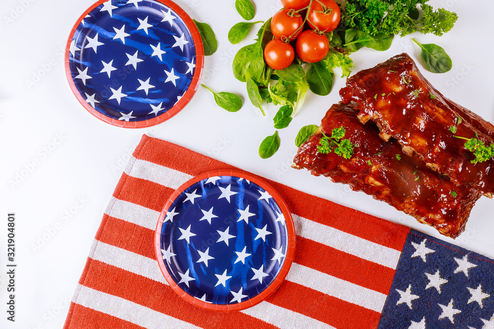 Wall mural party table with tater bbq baby back ribs for independence day.