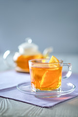 Selective focus photo of citrus tea with lemon, orange and mint