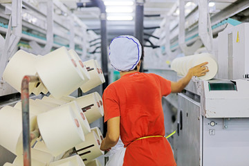 Women spinners are busy on the production line, Luannan County, Hebei Province, China