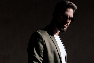 young unshaved fashion model posing in a fashion light