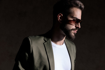 unshaved young fashion model looking to side