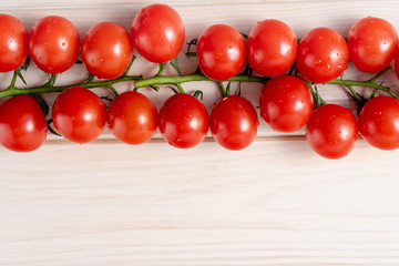 Cherry tomatoes on the white wooden table