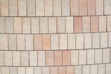Texture of pink rectangular paving tiles covering.