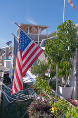 american flags in front of houseboat