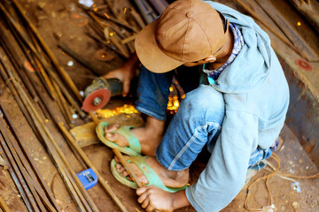 Close-up view of cutting steel shape, huge amount of sparks. Angle grinder sparks angle grinder...