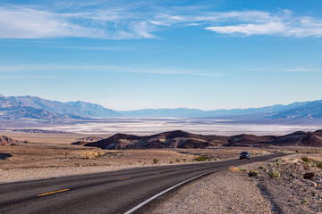 A road in Death Valley National Park, California, with the salt flats in the distance