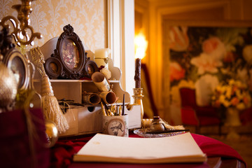 The book for the newlyweds congratulation and beautiful wedding gifts box for guests at wedding reception. The decoration arrangements at wedding party.