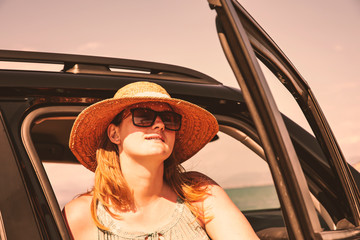 Summer car and woman with hat . 