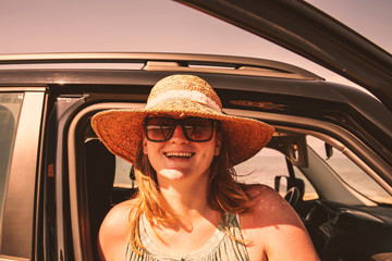 Fototapeta premium Summer car and woman with hat . 