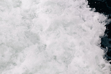 seething sea foam from a wave that broke on a rock. natural sea background