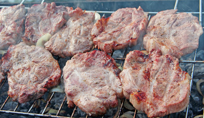 Steak on barbecue. Preparation appetizing pork outside