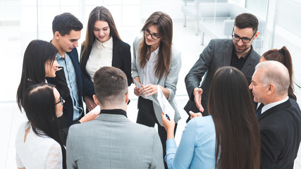 Fototapeta premium boss and a group of employees discussing business documents.