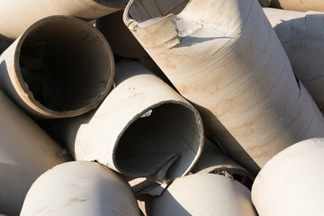 Textures of discarded paper in waste material storage.