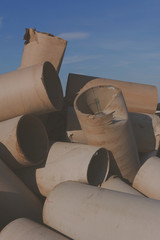 Textures of discarded paper in waste material storage.