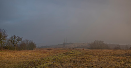 Meadow near Radobyl hill in north Bohemia in winter morning
