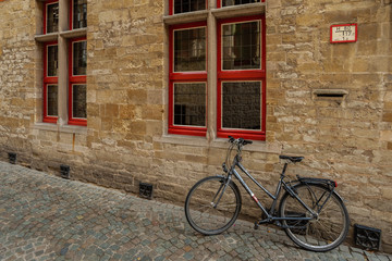Fototapeta na wymiar Bicycle and Stone Wall in Bruges, Betgium