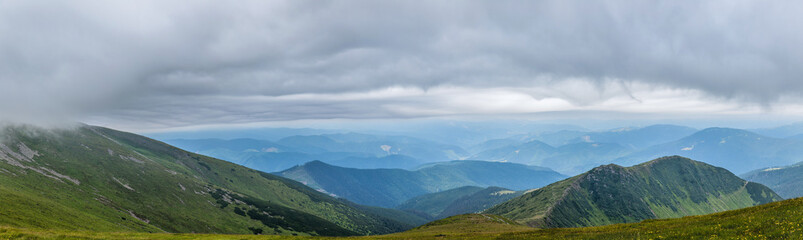 Fototapeta premium Panorama of beautiful, green mountains with clouds and forest. Ukraine, Carpathians.
