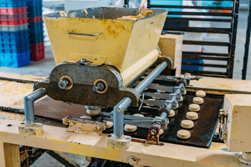 Working cookie forming machine in confectionery factory