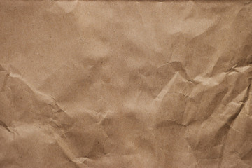Rough crumpled manilla brown paper background