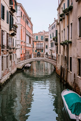 Narrow canal and bridge in Venice, Italy