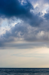 sea landscape is a pebbly beach with waves in white foam