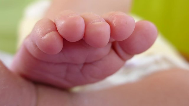  Footage of a newborn baby feet while sleeping