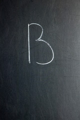 Letter L on a chalk board. School concept.