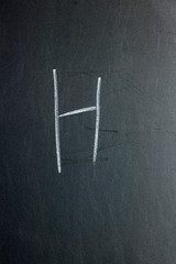 Letter L on a chalk board. School concept.