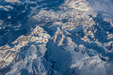 Fototapeta na wymiar View from the plane to the Alps - Dolomites in Italy