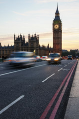 Cars passing by Big Ben in London England United Kingdom UK