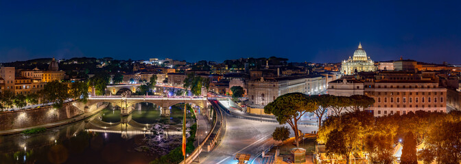 Panorama of Rome and Basilica of St. Peter at night, Italy