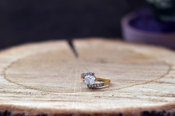  wedding rings on a wooden background for valentines day