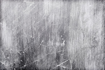 Grey grunge scratches on an outside wall panel
