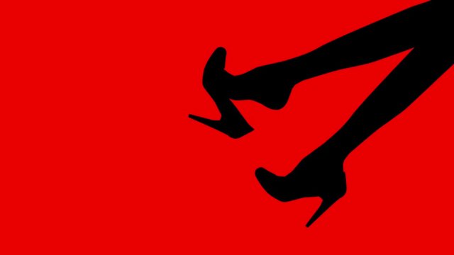 woman dangling high heel shoe