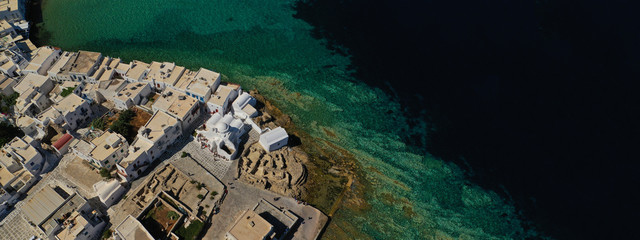 Aerial drone ultra wide photo of famous whitewashed chapel of Paraportiani in Little Venice area, Mykonos island, Cyclades, Greece