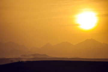 A view of mountains and sunset in the desert of Egypt