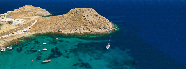 Aerial drone ultra wide photo of famous beach of Agia Anna in island of Mykonos, Cyclades, Greece