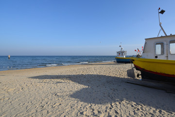 Fishing boats onshore with a sea landscape in perspective