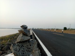 Photos of a stone pile laid on the side of the road