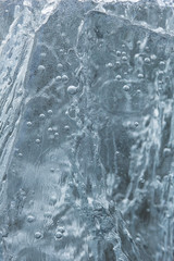 Abstract photo of close-up of frozen air bubbles in ice in the winter.